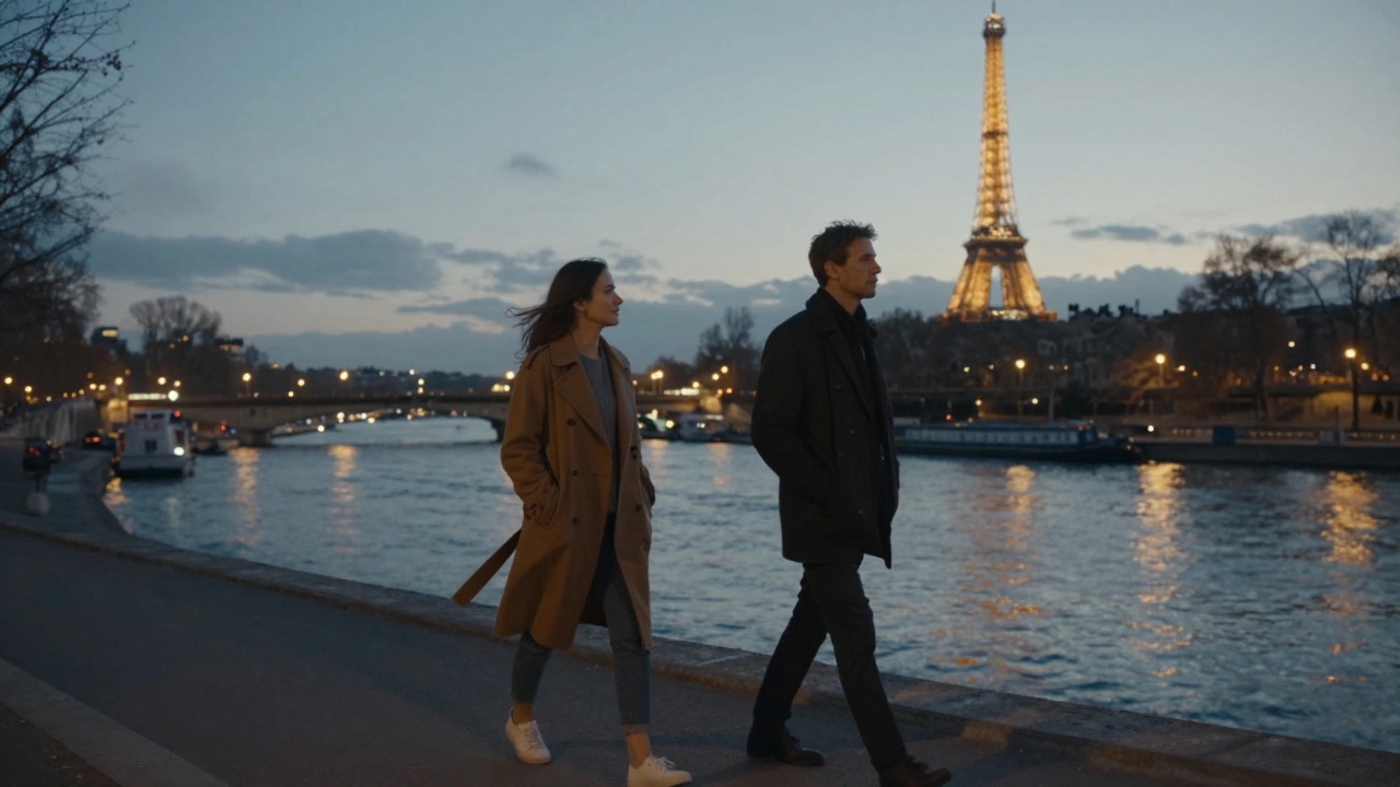 Two people walking peacefully along the Seine at twilight, city lights reflecting on the water.